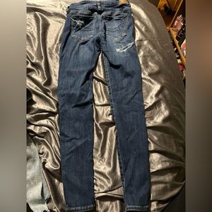 American Eagle size 2 blue ripped jeans with blue jean patches underneath